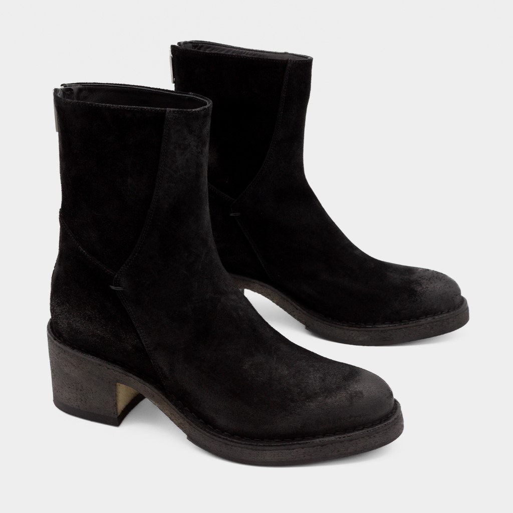 Sort skolett med rågummisåle og glidelås bak