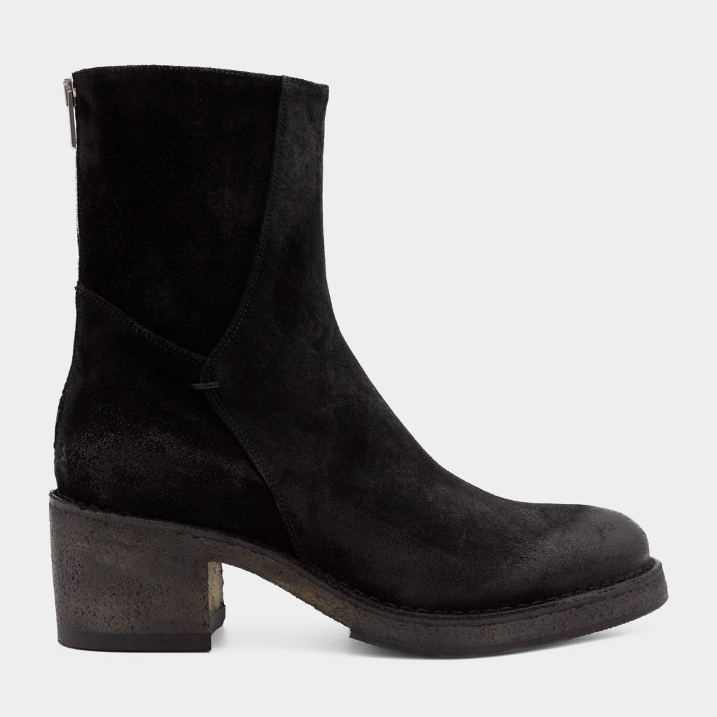 Sort skolett med rågummisåle og glidelås bak